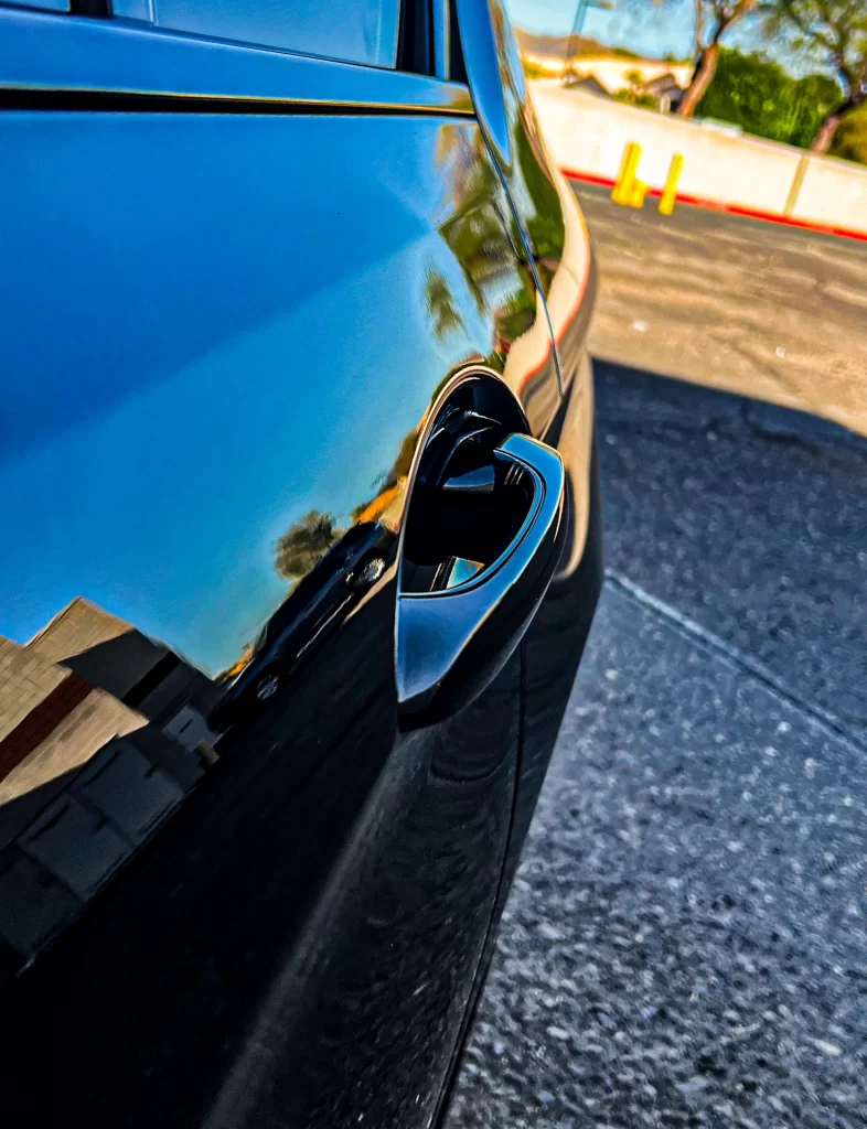 Dent on a BMW in Phoenix before mobile paintless dent repair by Patriot Dent Repair