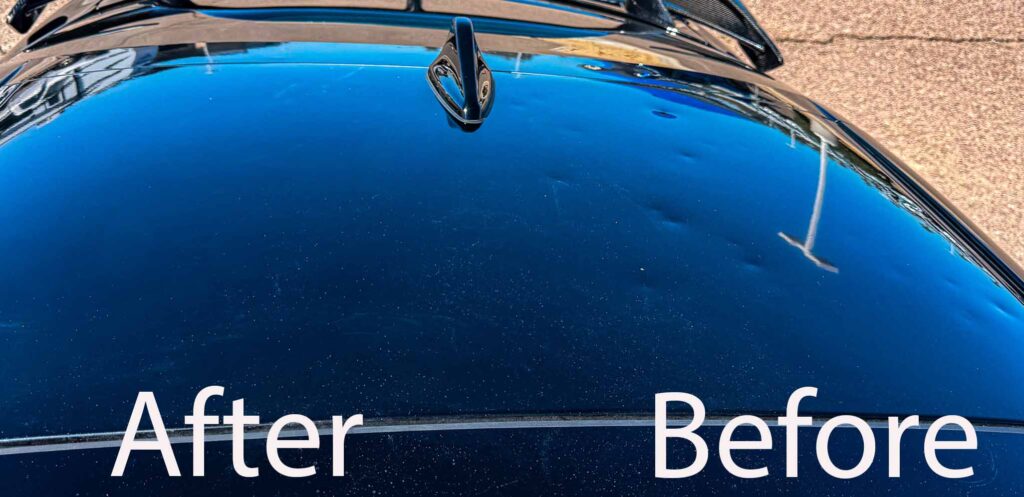 Close-up showing partial paintless dent repair on the roof of a 2023 Kia Stinger. Half the roof still covered in hailstorm damage, the repaired section demonstrates complete dent removal while preserving the original paint.