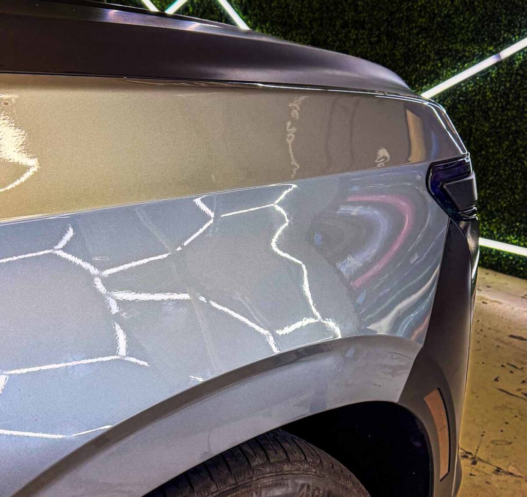 2025 Cadillac Escalade front fender after large dent repair using Paintless Dent Repair (PDR). Fully restored to factory condition with zero visible evidence of the damage.